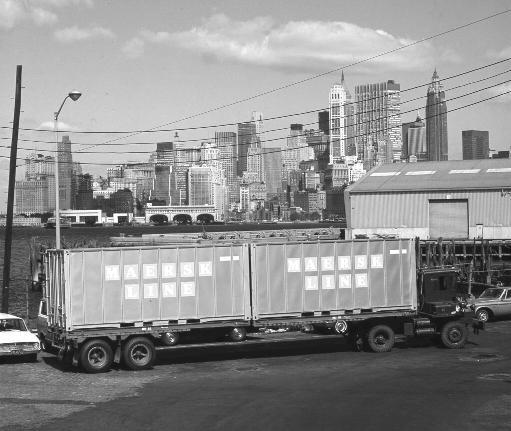 Maersk Line containers in 1975, with the Financial District of Manhattan in the background.