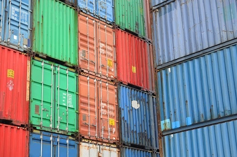 Used rusted containers are stacking at yard.